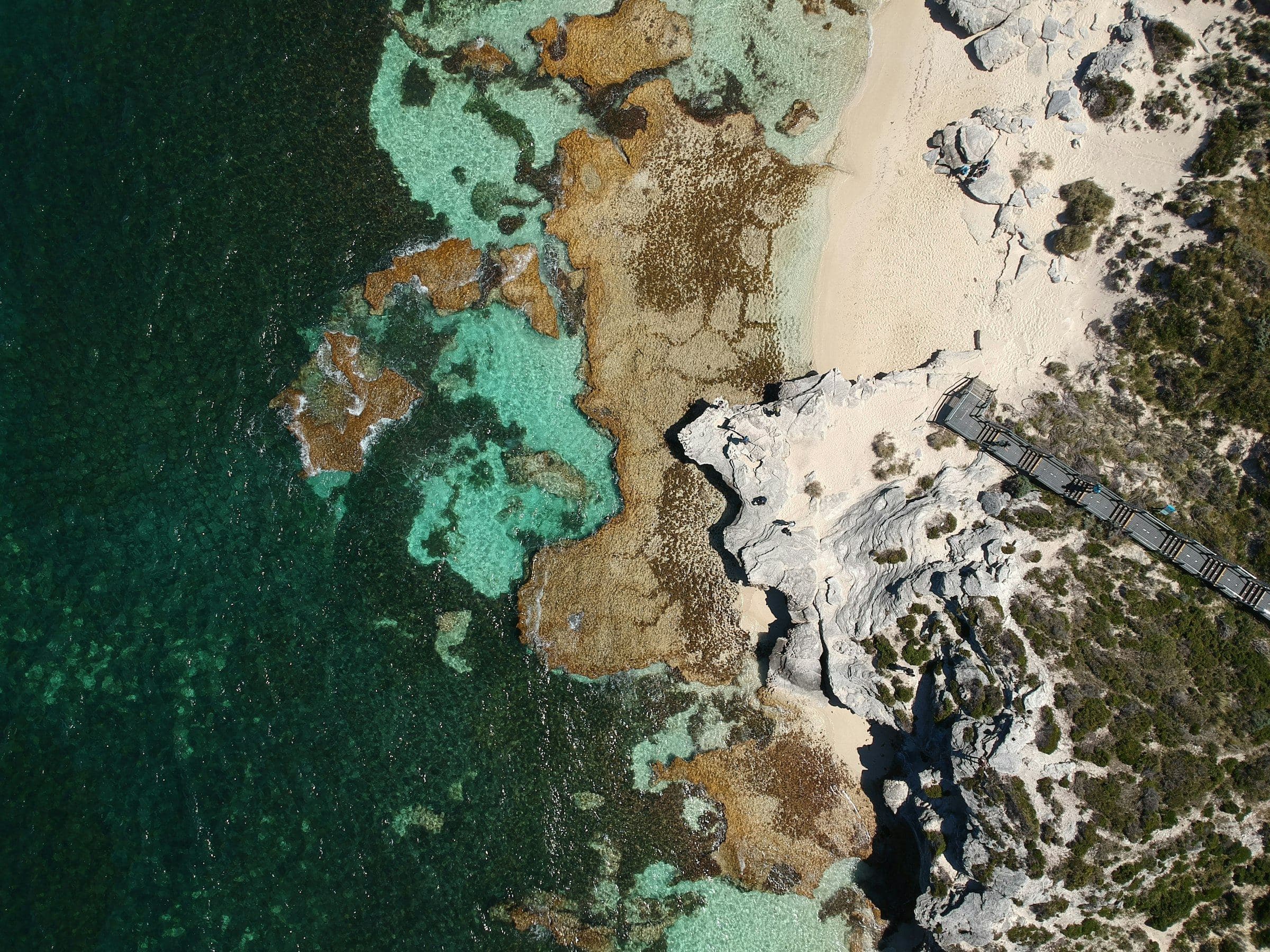 Reef, rock and turquoise water at Parker Point, Rottnest Island, from above