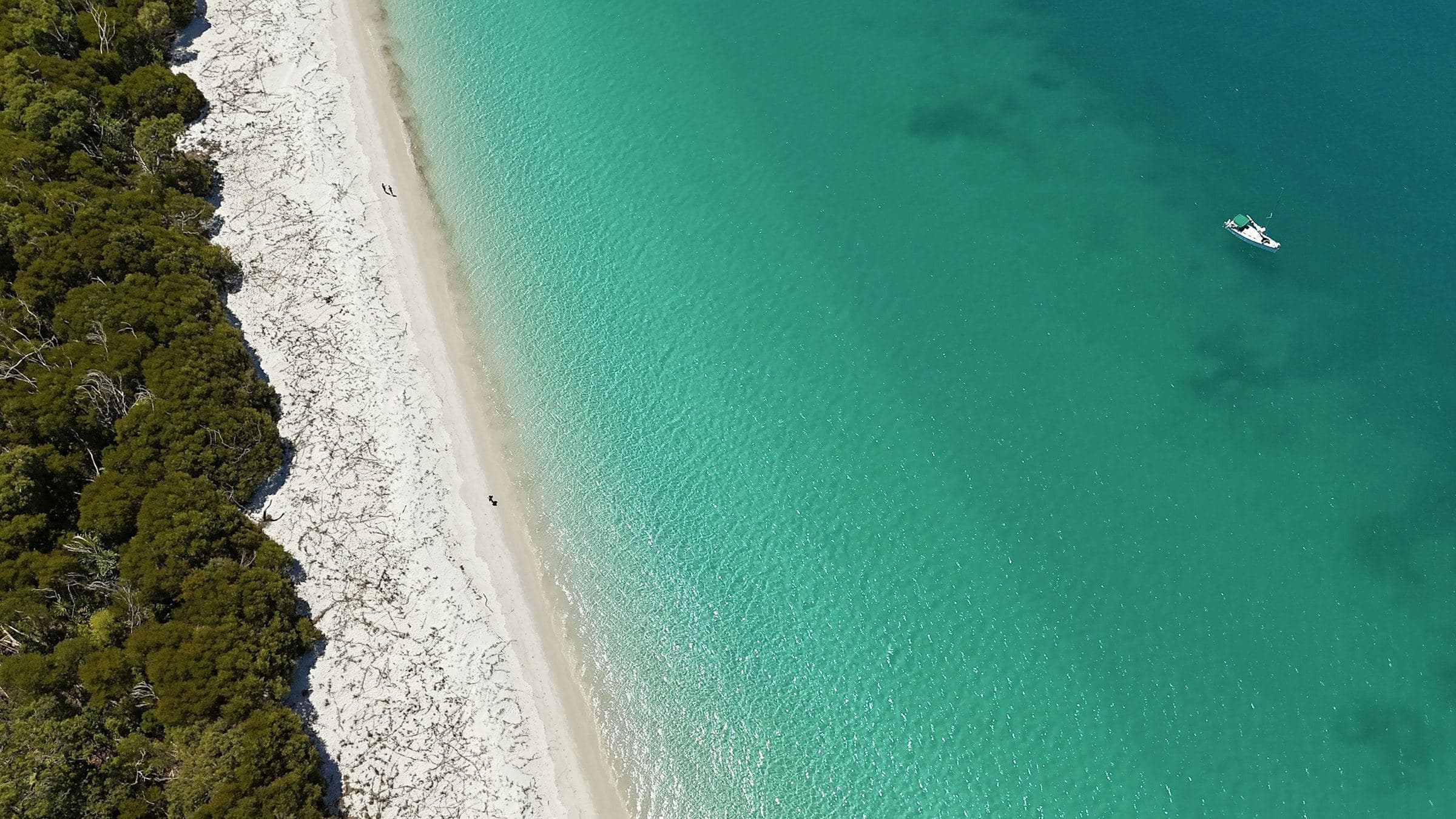 White sand meeting turquoise water at Whitehaven Beach, Queensland, from above